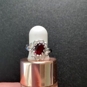 Tiny sterling silver ring with red stone